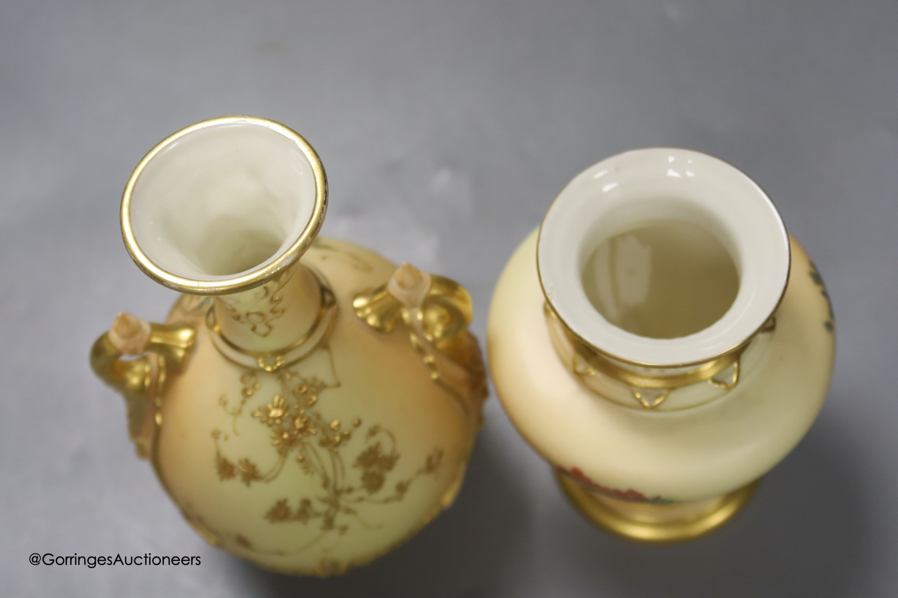 A Royal Worcester blush leaf dish, a pair of ewers, a two handled vase and another